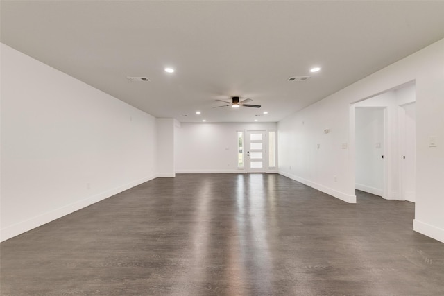 empty room featuring baseboards, recessed lighting, ceiling fan, and dark wood-style floors