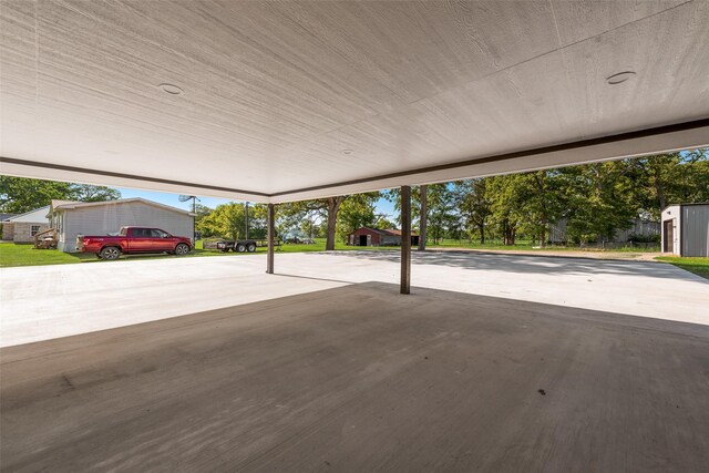 empty room featuring baseboards, marble finish floor, a wall mounted AC, and recessed lighting