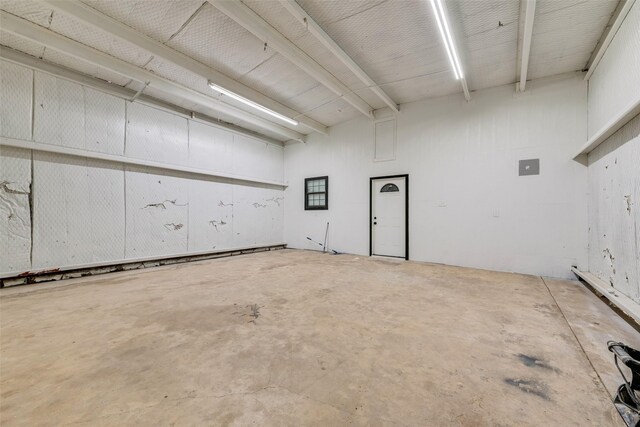 basement with recessed lighting, a wall mounted air conditioner, and marble finish floor