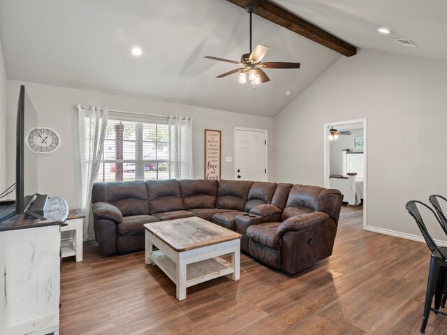 living area featuring visible vents, wood finished floors, beam ceiling, recessed lighting, and a ceiling fan