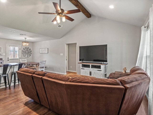 living room featuring high vaulted ceiling, a ceiling fan, wood finished floors, beamed ceiling, and visible vents