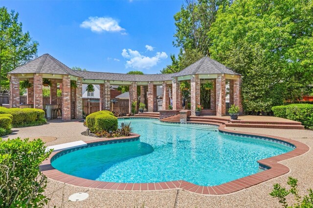 outdoor pool featuring a gazebo