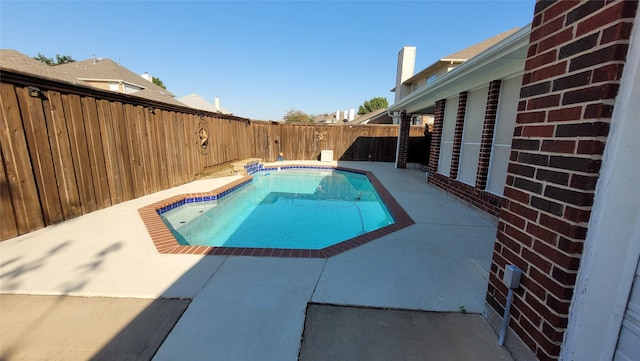 view of pool with a patio area, a fenced in pool, and a fenced backyard