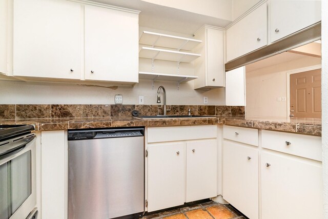 kitchen featuring stainless steel appliances, open shelves, a sink, and white cabinets
