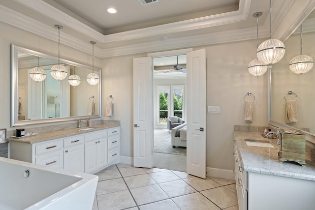 801 Giverny Ln, Southlake, TX 76092 - bathroom featuring vanity, crown molding, a raised ceiling, baseboards, and recessed lighting