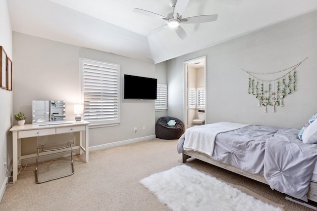 carpeted bedroom with connected bathroom, ceiling fan, lofted ceiling, and baseboards