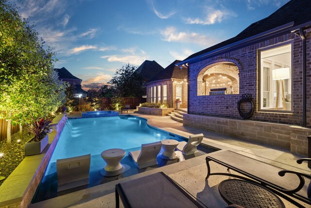 801 Giverny Ln, Southlake, TX 76092 - pool at dusk with a fenced backyard and a patio