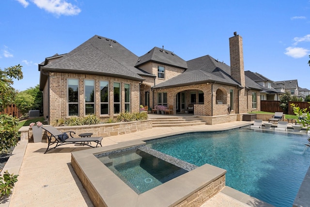 801 Giverny Ln, Southlake, TX 76092 - view of swimming pool with a patio, a pool with connected hot tub, and central AC