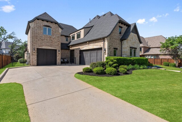 801 Giverny Ln, Southlake, TX 76092 - french provincial home with driveway, roof with shingles, brick siding, stone siding, and a garage