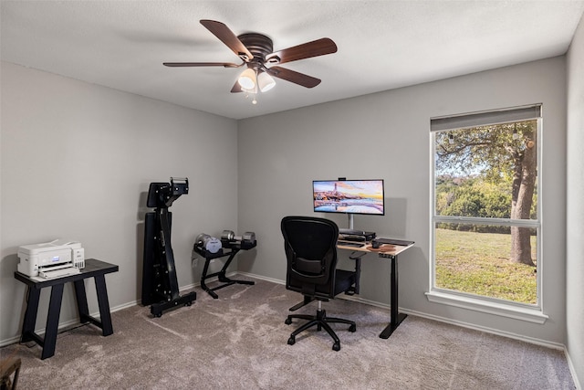 home office featuring ceiling fan, carpet floors, and baseboards