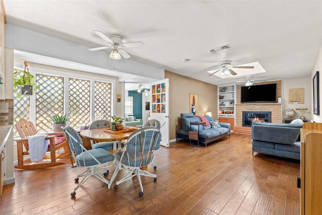 dining area featuring ceiling fan, a wealth of natural light, and visible vents