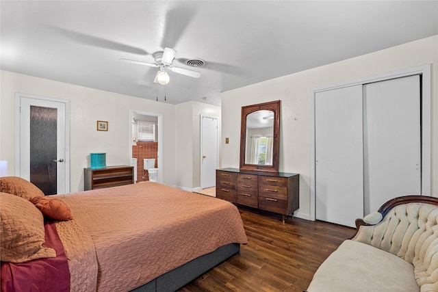 bedroom featuring dark wood finished floors, visible vents, baseboards, and multiple windows
