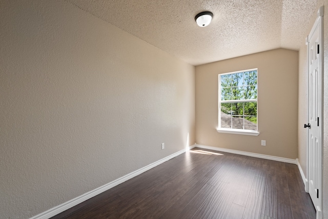 unfurnished room with baseboards, a textured ceiling, and dark wood finished floors