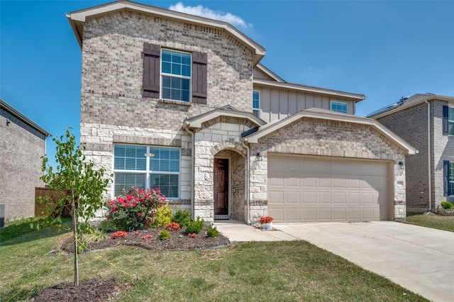 traditional-style house featuring stone siding, concrete driveway, a garage, board and batten siding, and a front yard