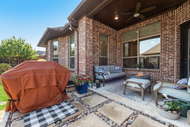 view of patio / terrace with grilling area, ceiling fan, an outdoor hangout area, and fence