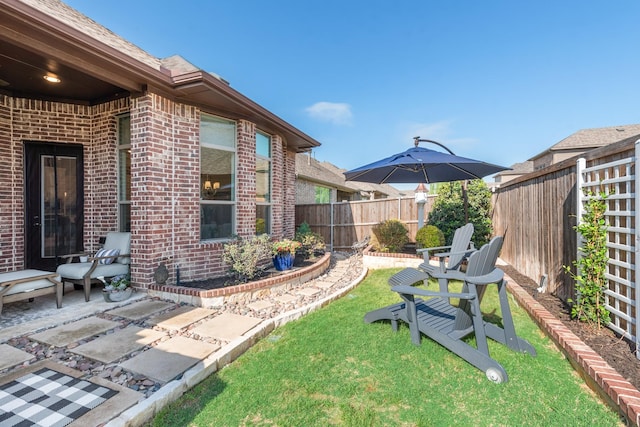 view of yard featuring a fenced backyard and a patio