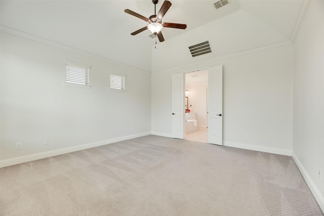 unfurnished room featuring visible vents, ornamental molding, baseboards, light colored carpet, and a ceiling fan