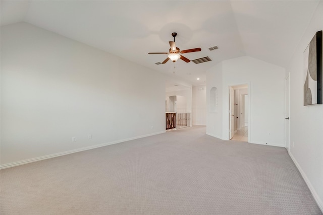 unfurnished living room with visible vents, a ceiling fan, lofted ceiling, and light carpet