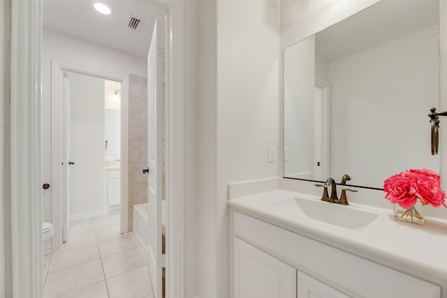 full bathroom featuring visible vents, vanity, toilet, tile patterned floors, and shower / washtub combination