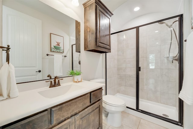full bath with toilet, tile patterned floors, a shower stall, and vanity