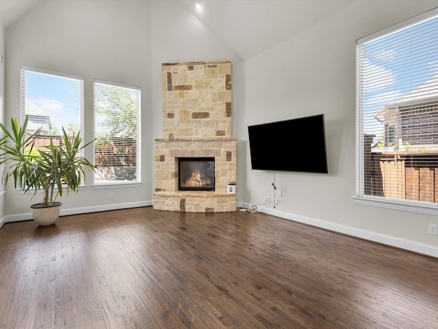 4600 Crossvine Dr, Prosper, TX 75078 - unfurnished living room with wood finished floors, a fireplace, baseboards, and high vaulted ceiling