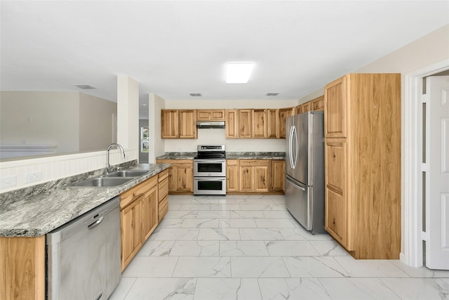 12109 Arbor Lake Rd, Rhome, TX 76078 - kitchen featuring marble finish floor, under cabinet range hood, visible vents, a sink, and appliances with stainless steel finishes