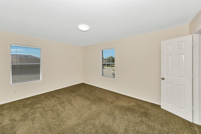12109 Arbor Lake Rd, Rhome, TX 76078 - empty room with baseboards and dark colored carpet
