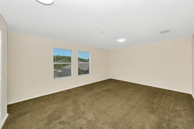 12109 Arbor Lake Rd, Rhome, TX 76078 - spare room with baseboards, dark colored carpet, and visible vents