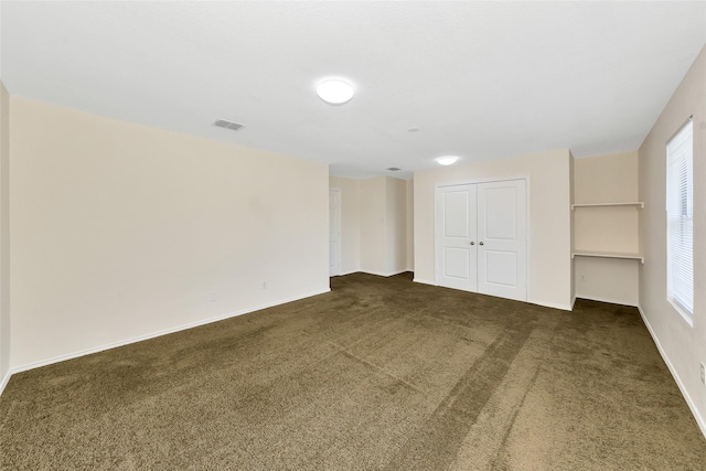 12109 Arbor Lake Rd, Rhome, TX 76078 - empty room with dark carpet, visible vents, and baseboards