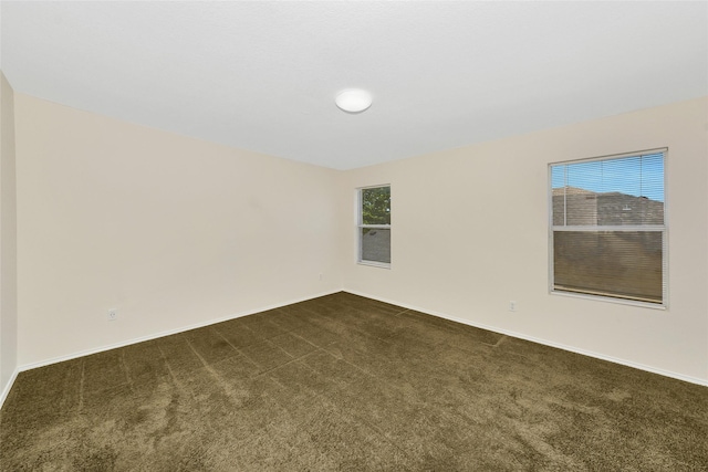 12109 Arbor Lake Rd, Rhome, TX 76078 - empty room with dark carpet and baseboards
