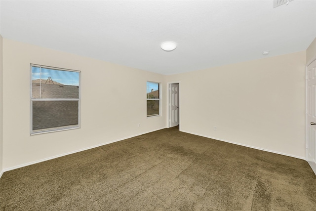 12109 Arbor Lake Rd, Rhome, TX 76078 - empty room with dark colored carpet and baseboards