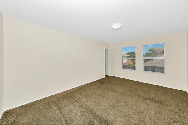 12109 Arbor Lake Rd, Rhome, TX 76078 - unfurnished room featuring dark colored carpet and baseboards