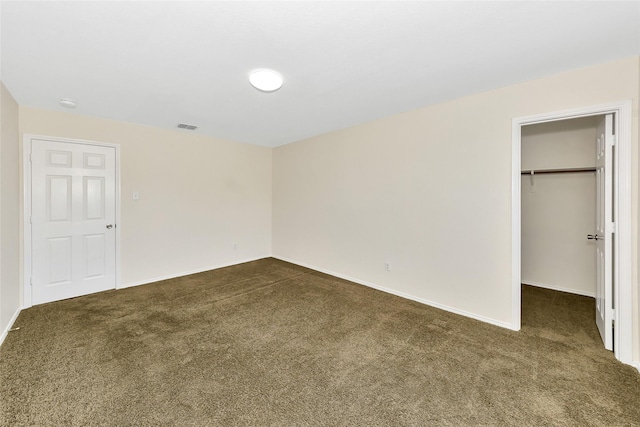 12109 Arbor Lake Rd, Rhome, TX 76078 - unfurnished bedroom with dark carpet, visible vents, baseboards, and a spacious closet