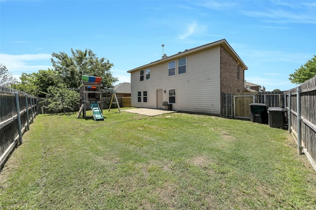 12109 Arbor Lake Rd, Rhome, TX 76078 - rear view of house featuring a fenced backyard, a patio, a playground, and a lawn