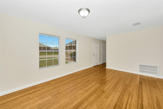 12109 Arbor Lake Rd, Rhome, TX 76078 - empty room featuring light wood-style floors, visible vents, and baseboards