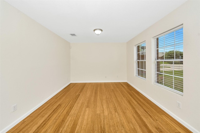 12109 Arbor Lake Rd, Rhome, TX 76078 - spare room with light wood-style flooring, visible vents, and baseboards
