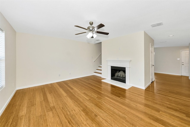 12109 Arbor Lake Rd, Rhome, TX 76078 - unfurnished living room featuring baseboards, a ceiling fan, light wood finished floors, and visible vents