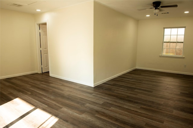 spare room with baseboards, a ceiling fan, dark wood-style floors, and recessed lighting