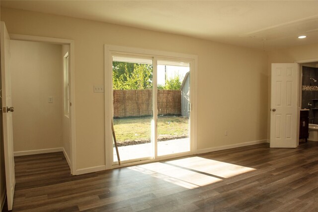 interior space featuring recessed lighting, baseboards, and dark wood-style flooring