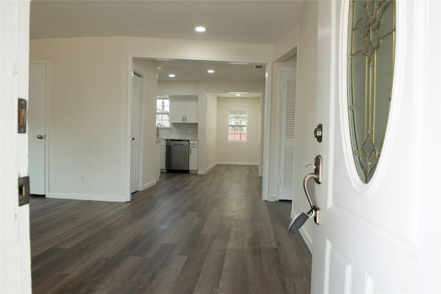 entrance foyer featuring baseboards, recessed lighting, and dark wood-style flooring