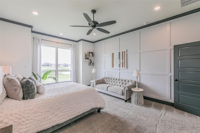 bedroom with visible vents, a decorative wall, recessed lighting, and ornamental molding