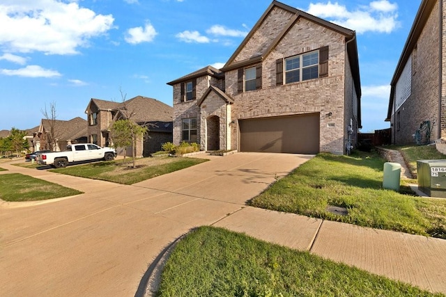 traditional-style house featuring a residential view, a front lawn, concrete driveway, a garage, and brick siding