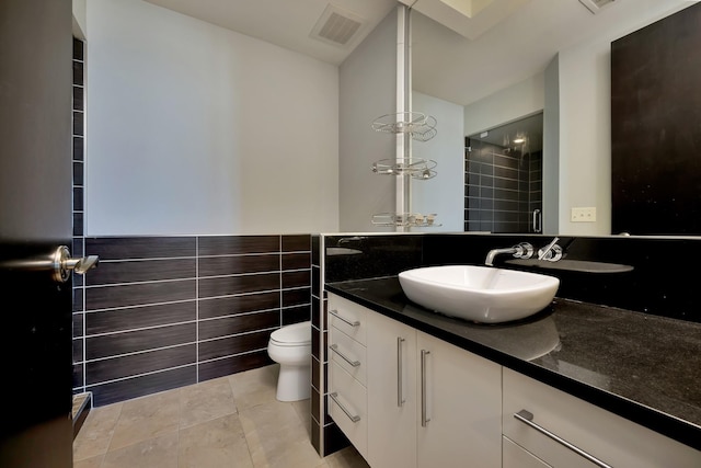 full bath featuring tile patterned floors, visible vents, vanity, and toilet