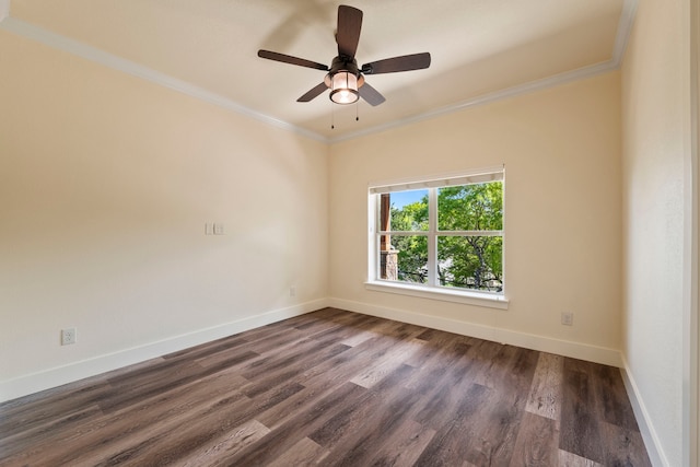 empty room with baseboards, dark wood finished floors, ceiling fan, and crown molding