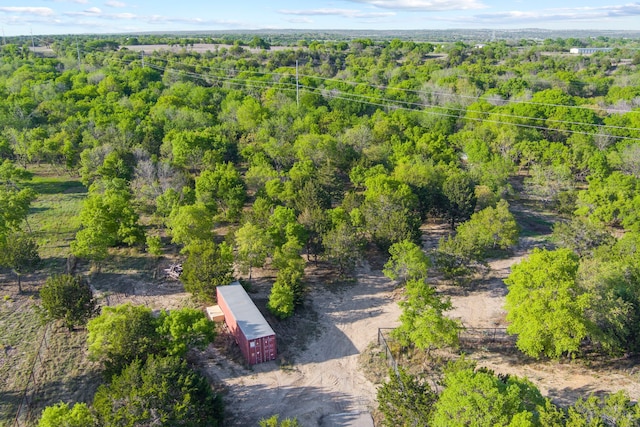 aerial view featuring a wooded view
