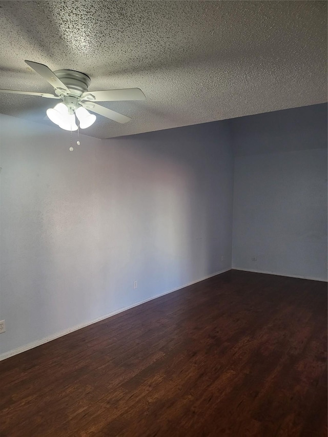 unfurnished room featuring a ceiling fan, wood finished floors, and a textured ceiling