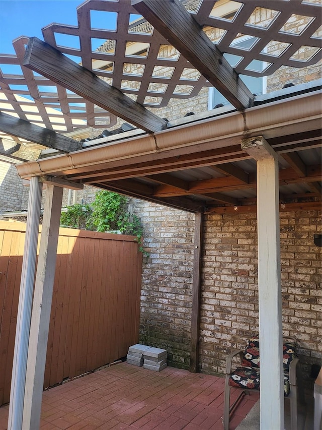 view of patio featuring fence