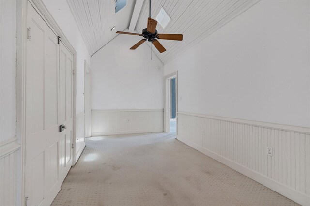 unfurnished bedroom with a ceiling fan, carpet, and ensuite bathroom
