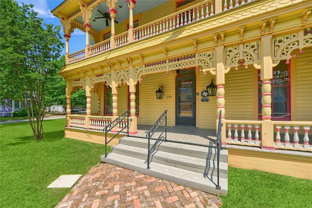 exterior space featuring a porch, a balcony, and a yard