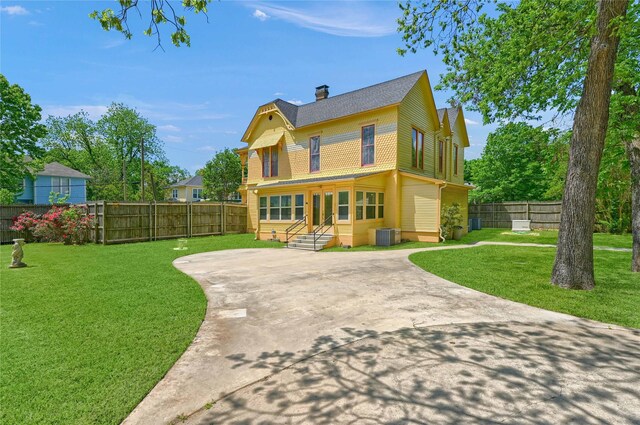 exterior space featuring an outdoor structure, a gazebo, fence, and a detached garage